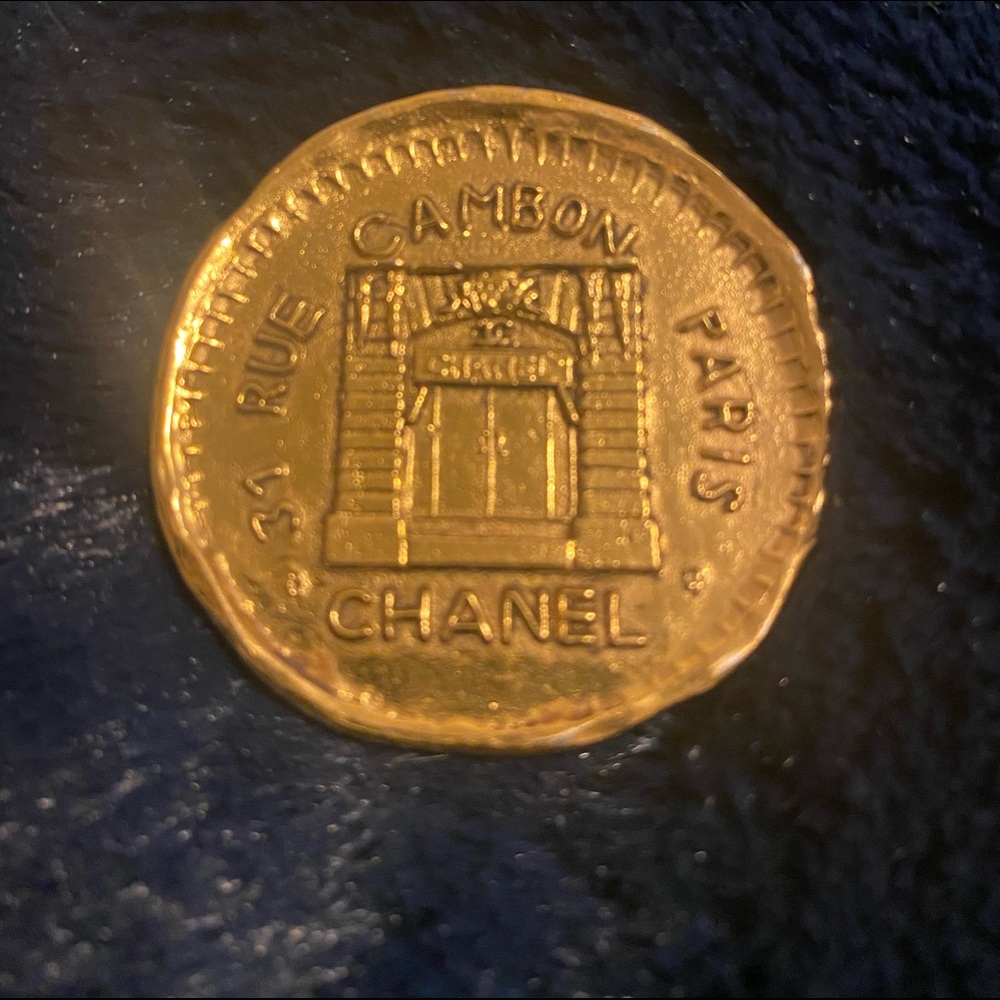 Gold tone Chanel Rue de Cambon brooch.